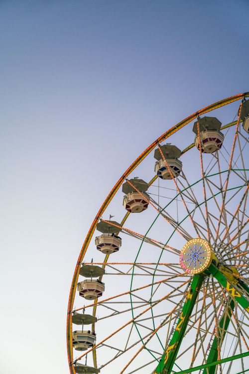Free Vertical shot of vibrant Ferris wheel in Boise, Idaho against a clear blue sky. Stock Photo