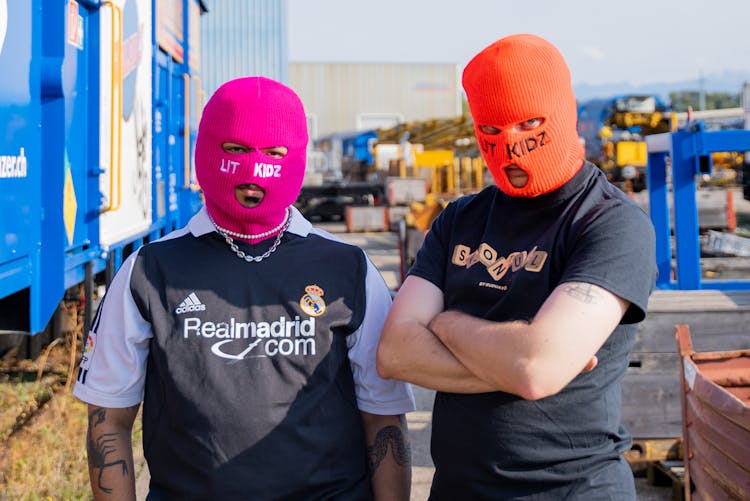 Men Wearing Pink And Orange Baklavas