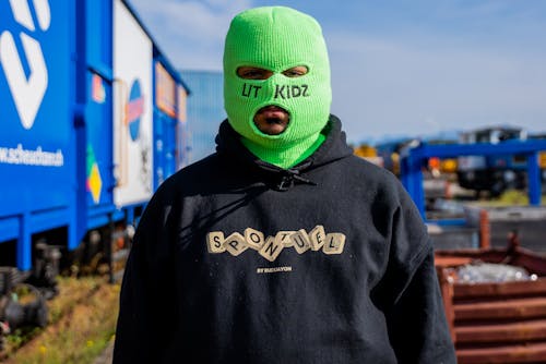 Free Close-Up Shot of a Person Wearing a Green Ski Mask Stock Photo