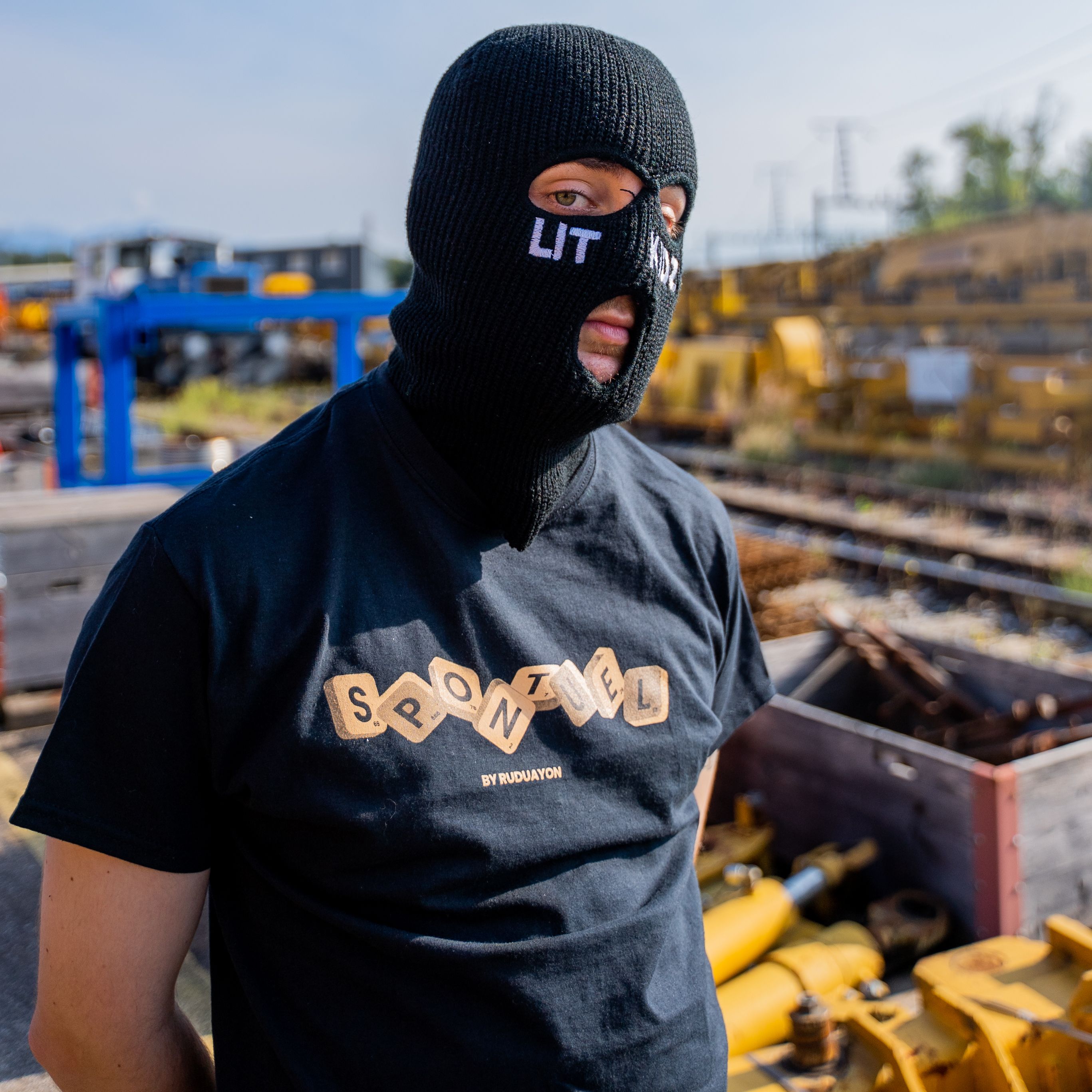 Man in Black Crew Neck T-shirt Wearing Black Knit Mask