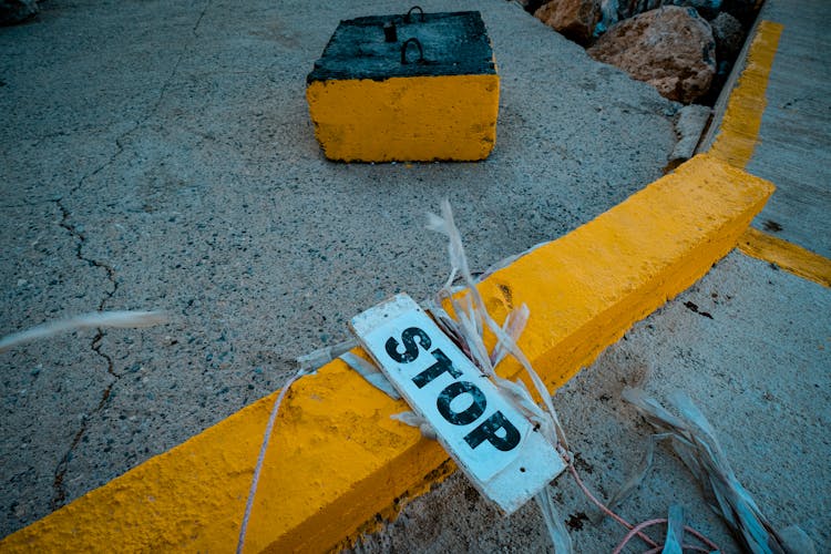 Close Up Of A Stop Sign On The Ground