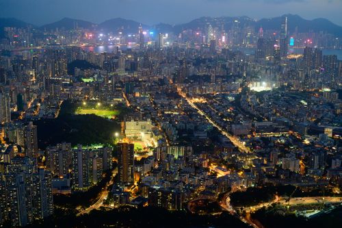 Free A breathtaking aerial shot capturing the vibrant Hong Kong skyline illuminated at night. Stock Photo
