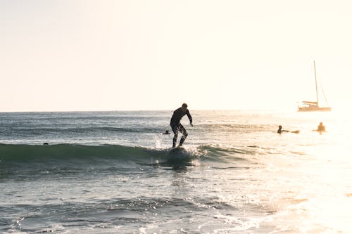 Photo of a Man Surfing