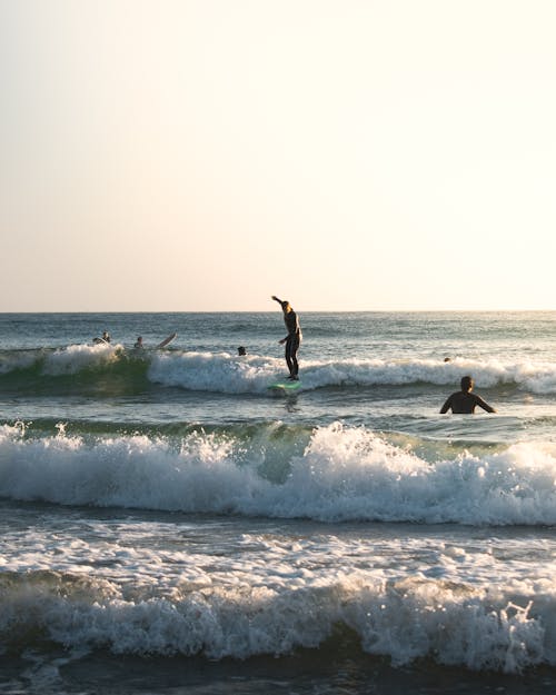 Man Surfing on Sea Waves