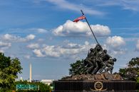 Black and Gray Statue of Man Holding Flag of America