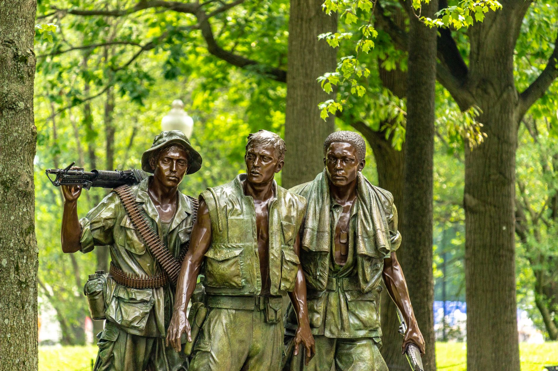 Bronze statues of soldiers at the Vietnam Veterans Memorial in Washington, DC.