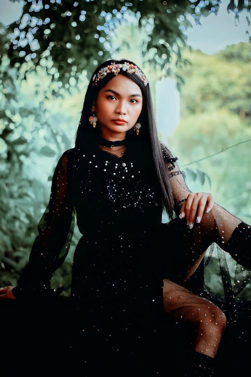 A Woman in Black Long Sleeve Dress