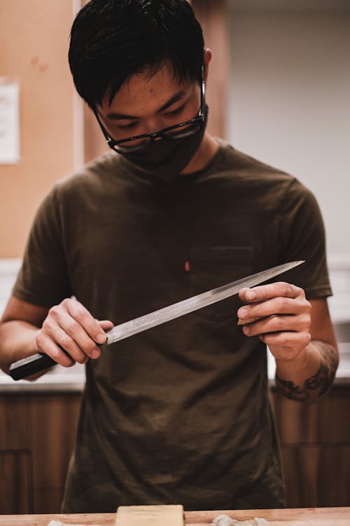 Free A Man Holding a Knife Stock Photo