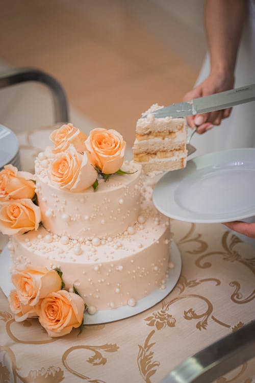 A Person Getting a Slice of Cake