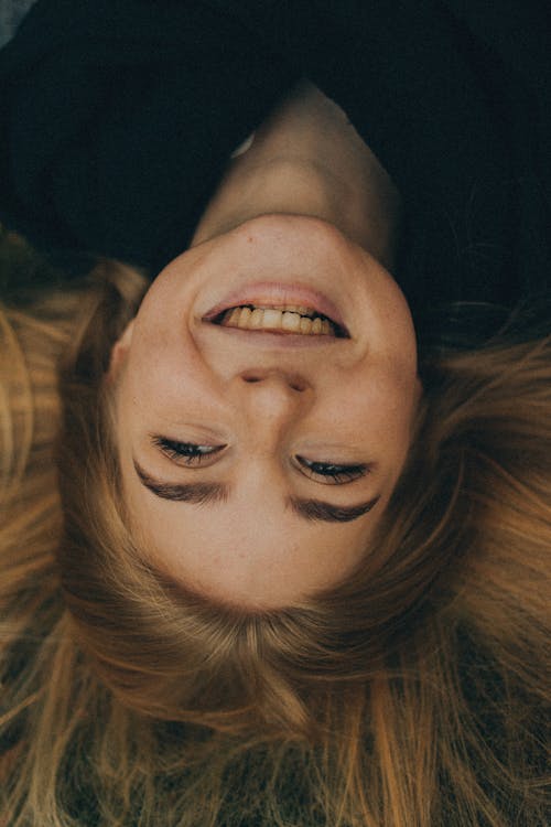 Free Close-Up Photo of a Beautiful Woman with a Happy Facial Expression Stock Photo