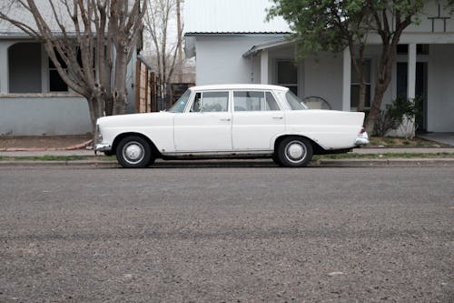 White Vintage Mercedez Parked Aside of the Road