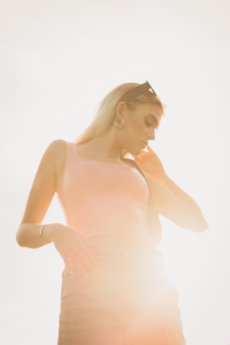 Photo Of A Woman Standing In The Sunlight 