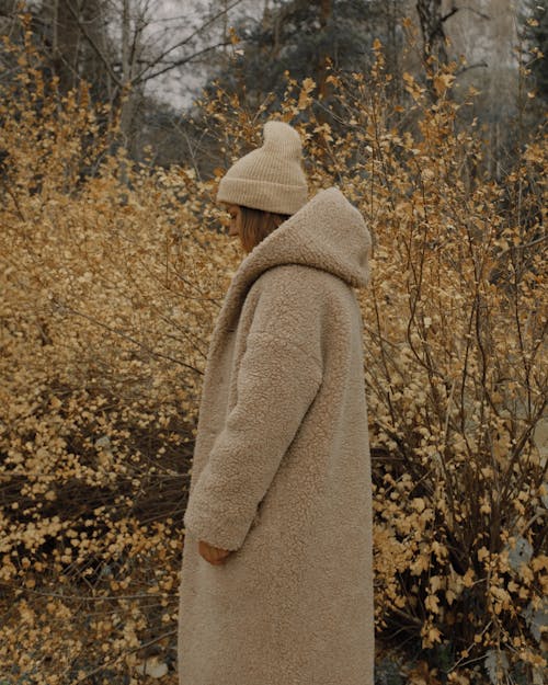 Woman in Brown Coat Wearing a Beanie