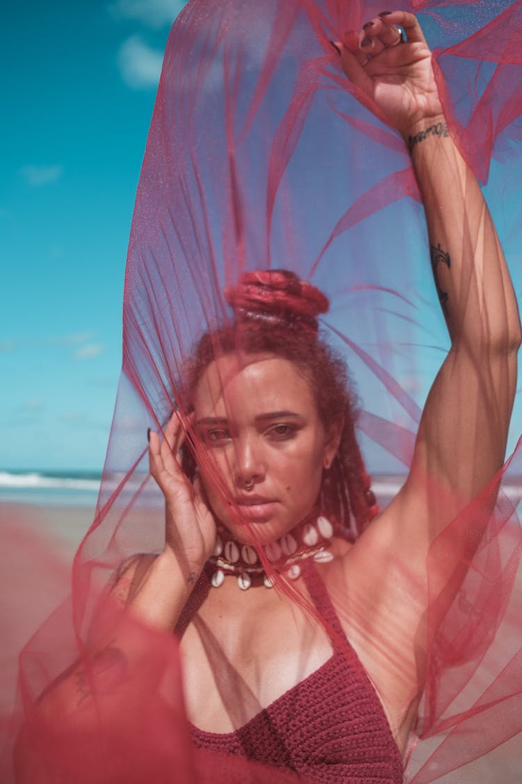 Black Woman Seen Through Red Cover