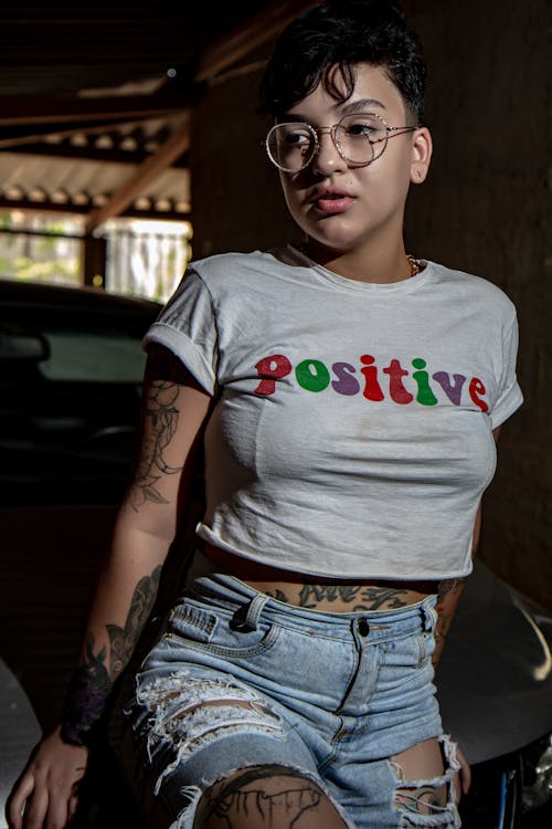 Woman in White Crew Neck T-shirt and Blue Denim Jeans