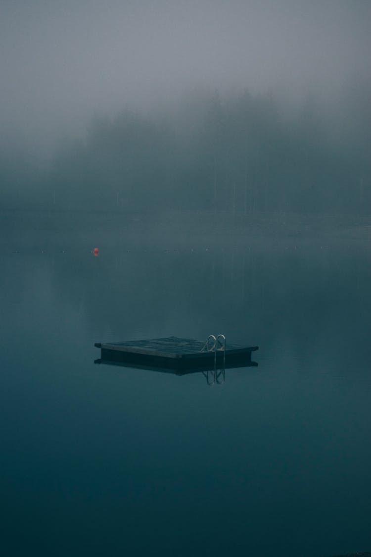 Wooden Platform Floating On Still Water 