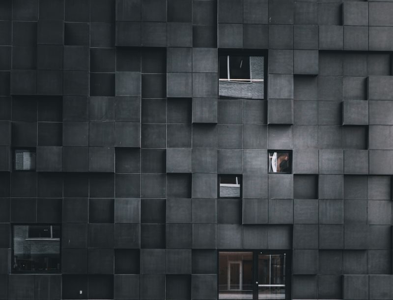 Dark geometric architectural facade — photo by Nur Yilmaz on Pexels