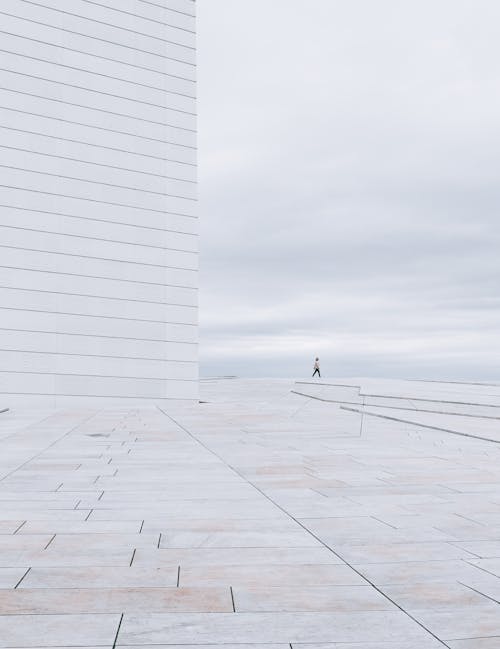 Walkway with a White Building against the Sky 