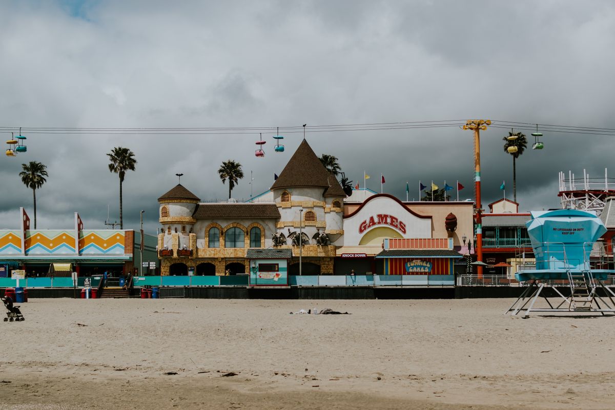 The wooden roller coaster and beach at the Santa Cruz boardwalk