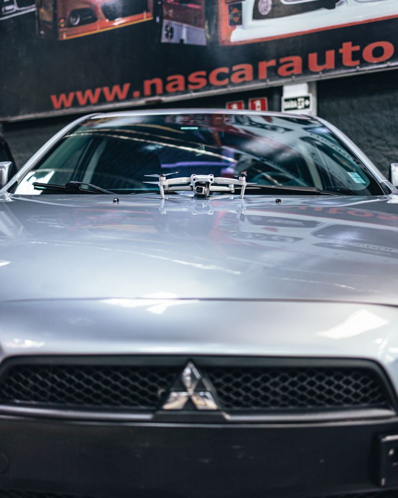 A sleek gray Mitsubishi in an automotive showroom