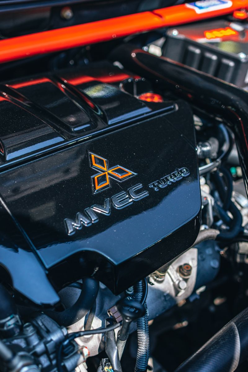 Detailed view of a MIVEC turbo car engine showcasing automotive technology and engineering.