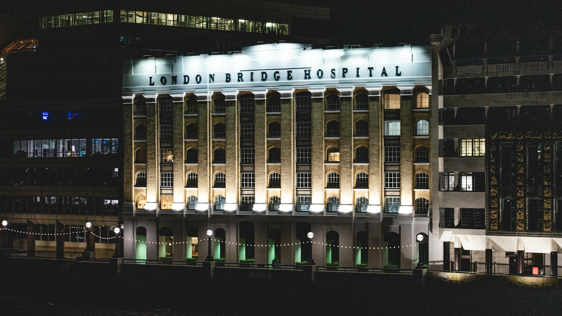 Nighttime view of London Bridge Hospital's illuminated exterior in the cityscape.