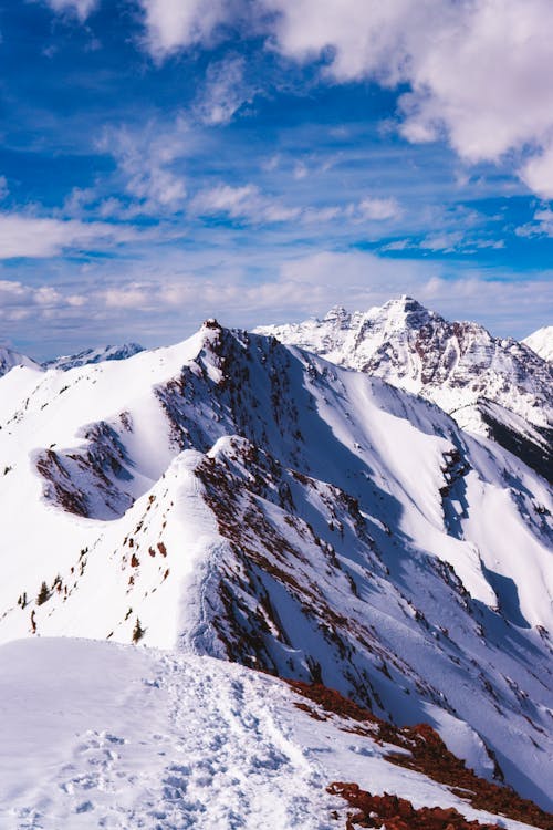 Snow Covered Mountain Under the Blue Sky