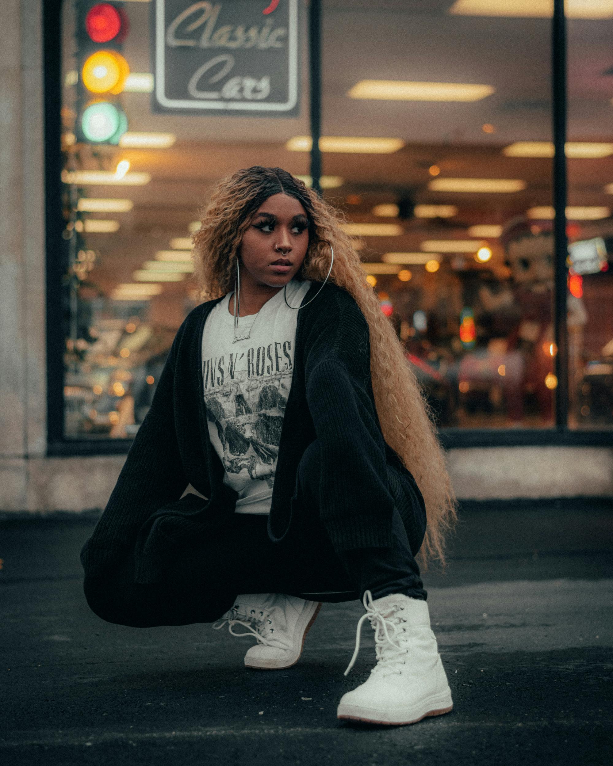 Woman Wearing Black Jacket Sitting on Street · Free Stock Photo