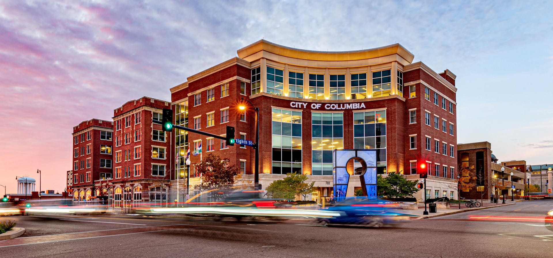 Colorful twilight view of downtown Columbia, Missouri capturing urban life and modern architecture.