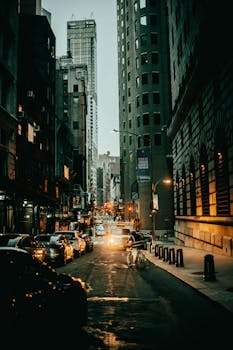Dynamic New York City street scene showcasing urban life and architecture at dusk.
