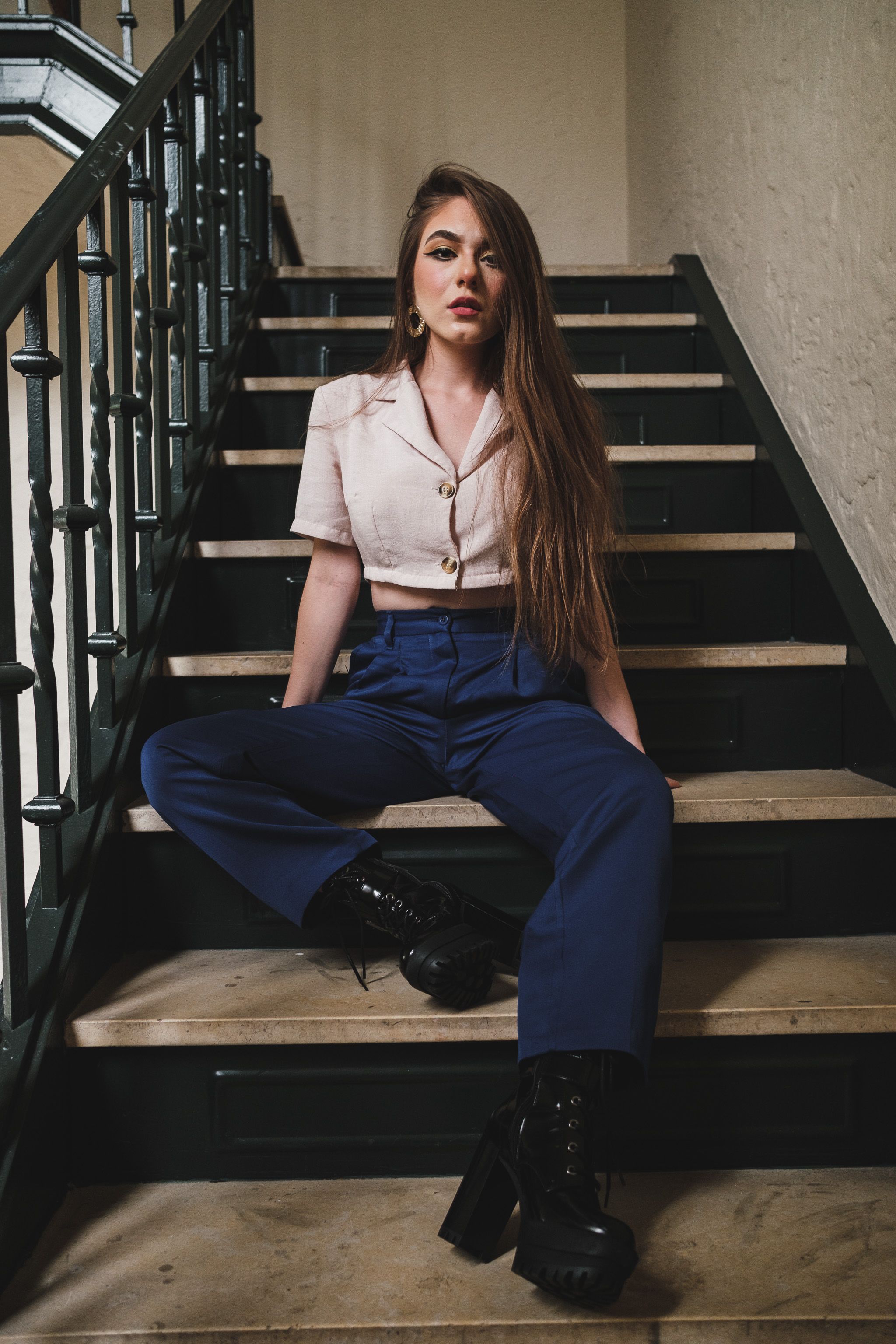 Woman in Beige Crop Top Sitting on Chair · Free Stock Photo