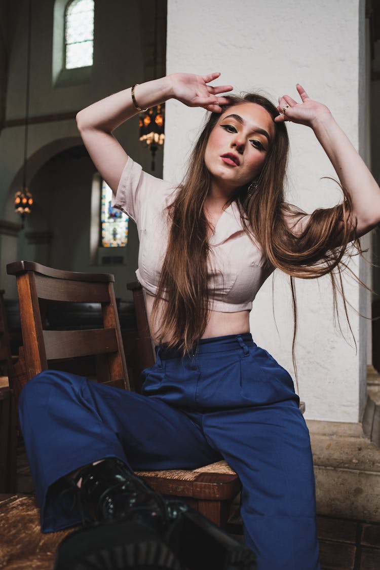 Woman Sitting On Wooden Chair