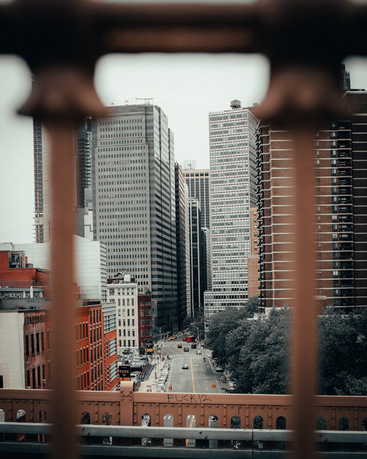 Street And Buildings In City Behind Bars