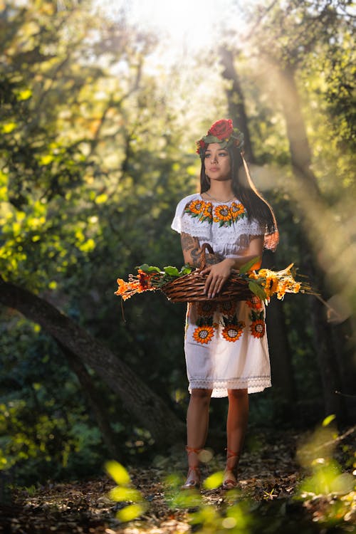 Woman Posing in Traditional Clothing in Forest