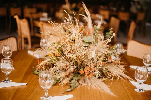 Free Beautiful dried flower arrangement as a centerpiece on a wooden table indoors. Stock Photo