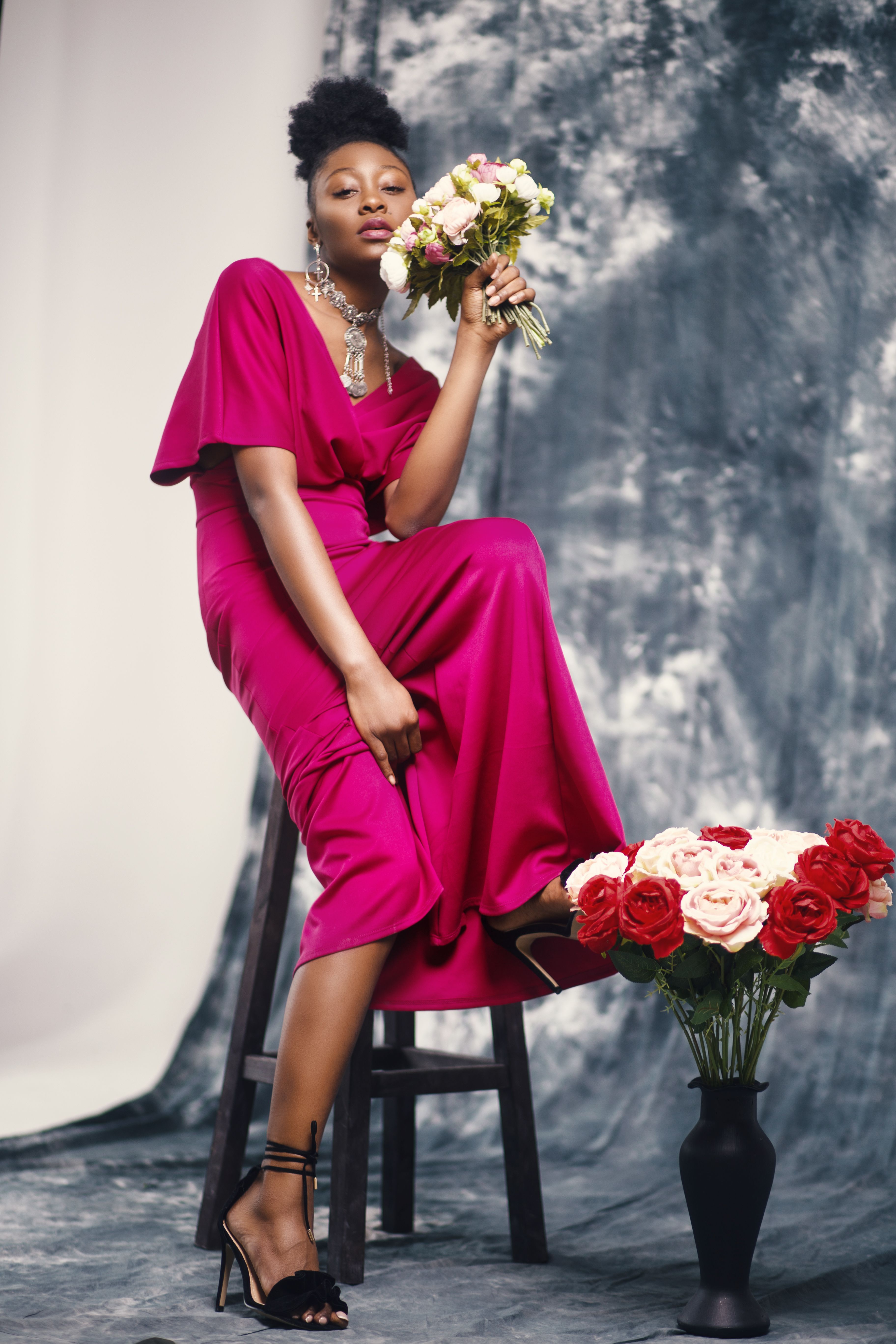 Woman in Pink Maxi Dress Holding Bouquet of Flowers · Free Stock Photo