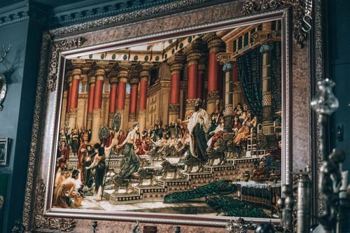 Free A framed historical painting depicting a classical scene in a gallery setting. Stock Photo
