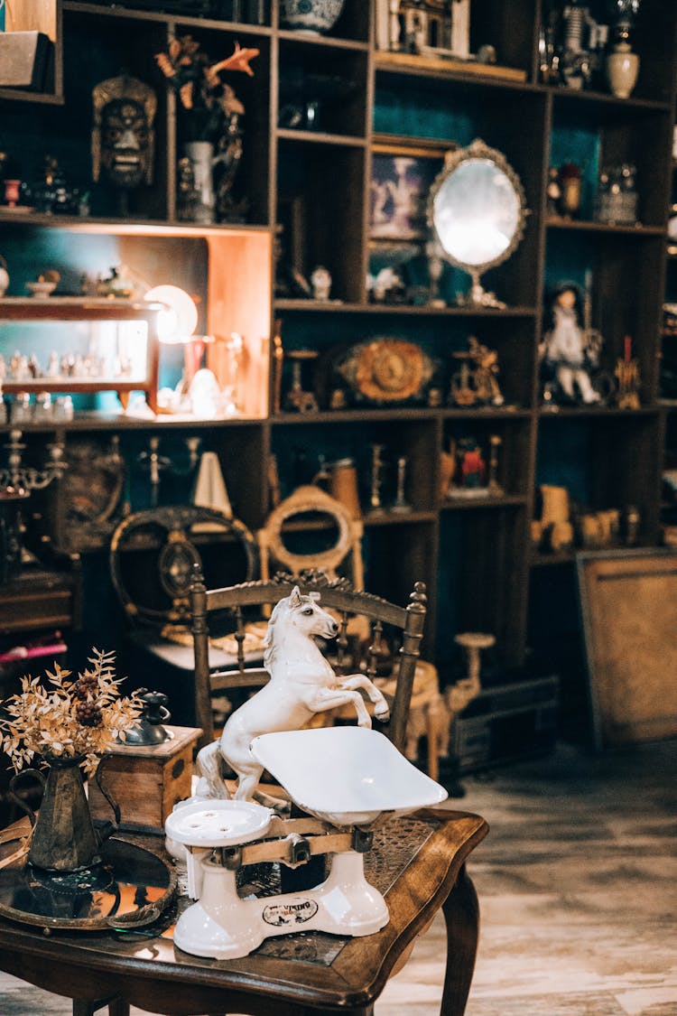 Trinkets Lying On Table In Antique Store