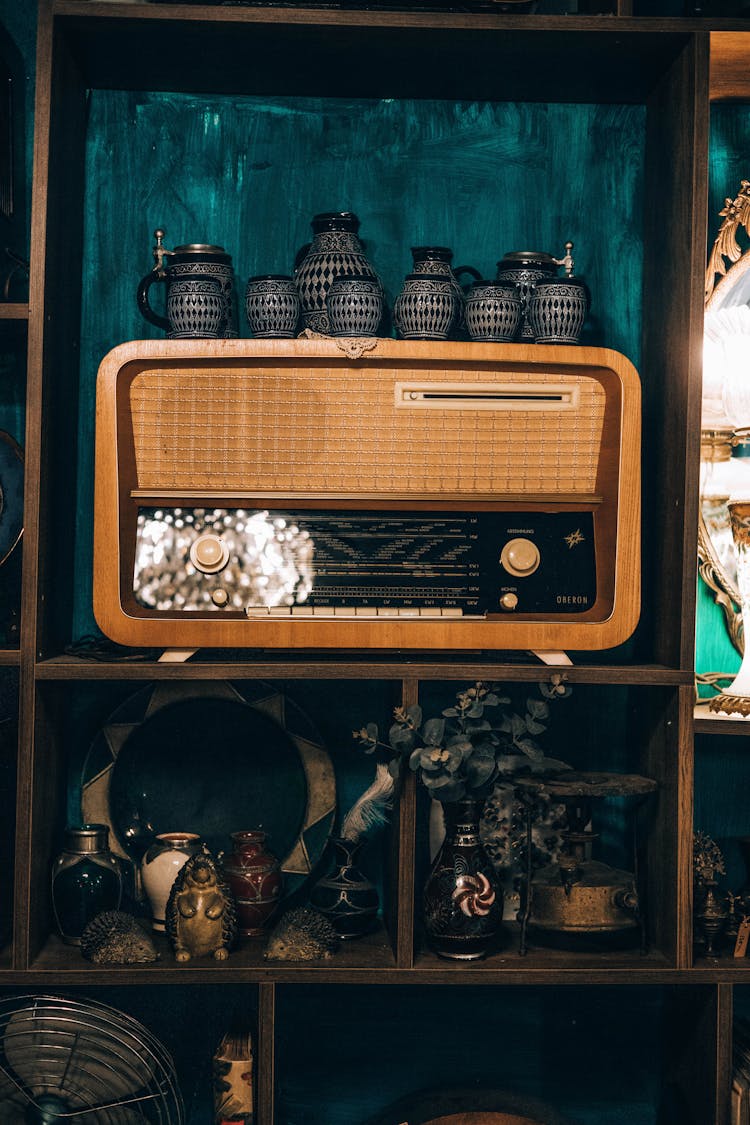 Radio And Vases On Shelf