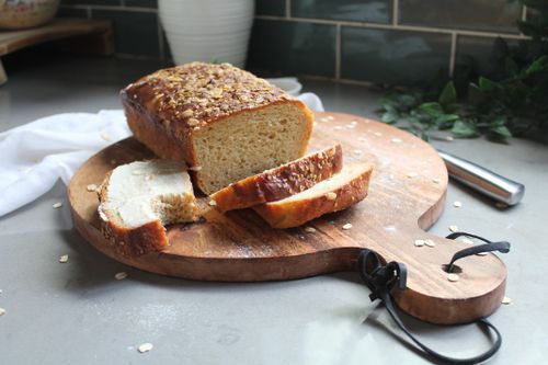 Free Delicious freshly baked oat bread on a wooden board indoors, perfect for healthy nutrition. Stock Photo