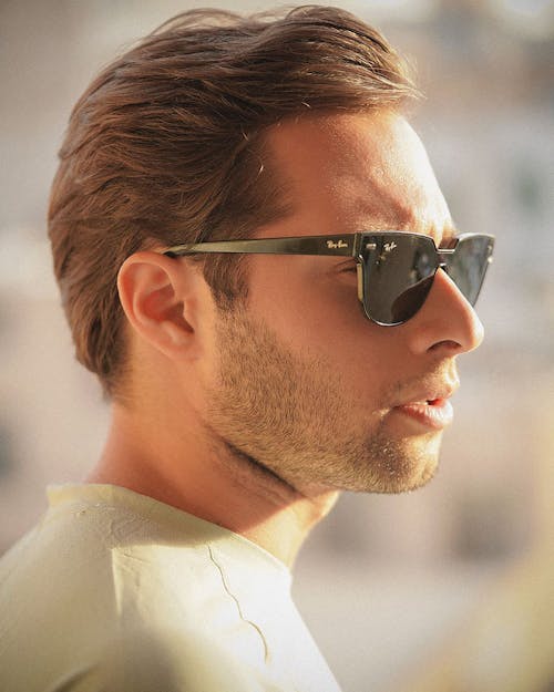 Man in White Crew Neck T Shirt Wearing Black Sunglasses