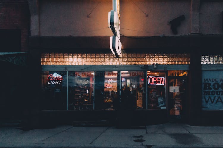 Open Neon Signage On A Store