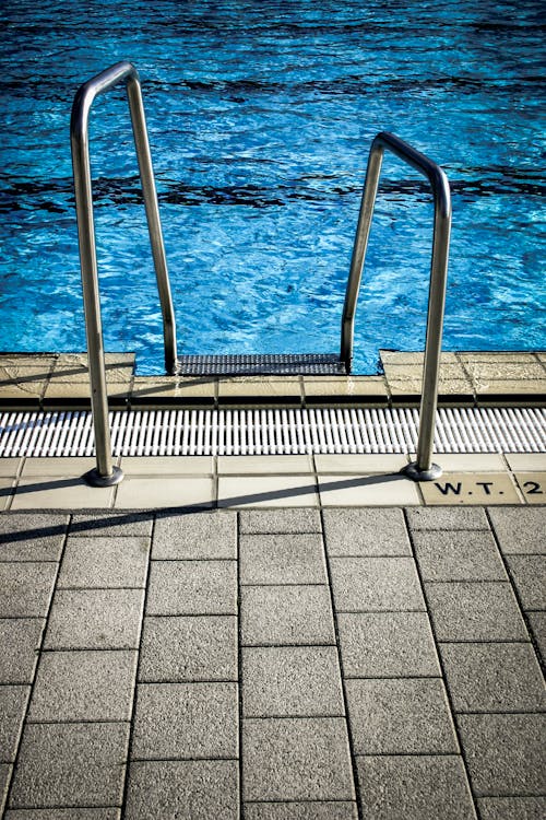 White Metal Railings Near Swimming Pool