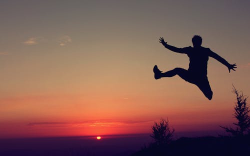 Free Silhouette Of A Jumping Man Stock Photo