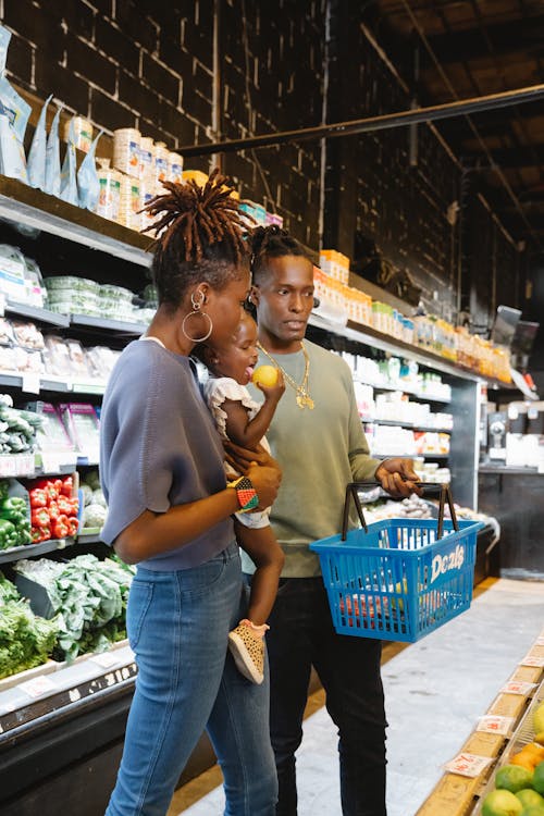 A Family Buying Groceries in a Supermarket