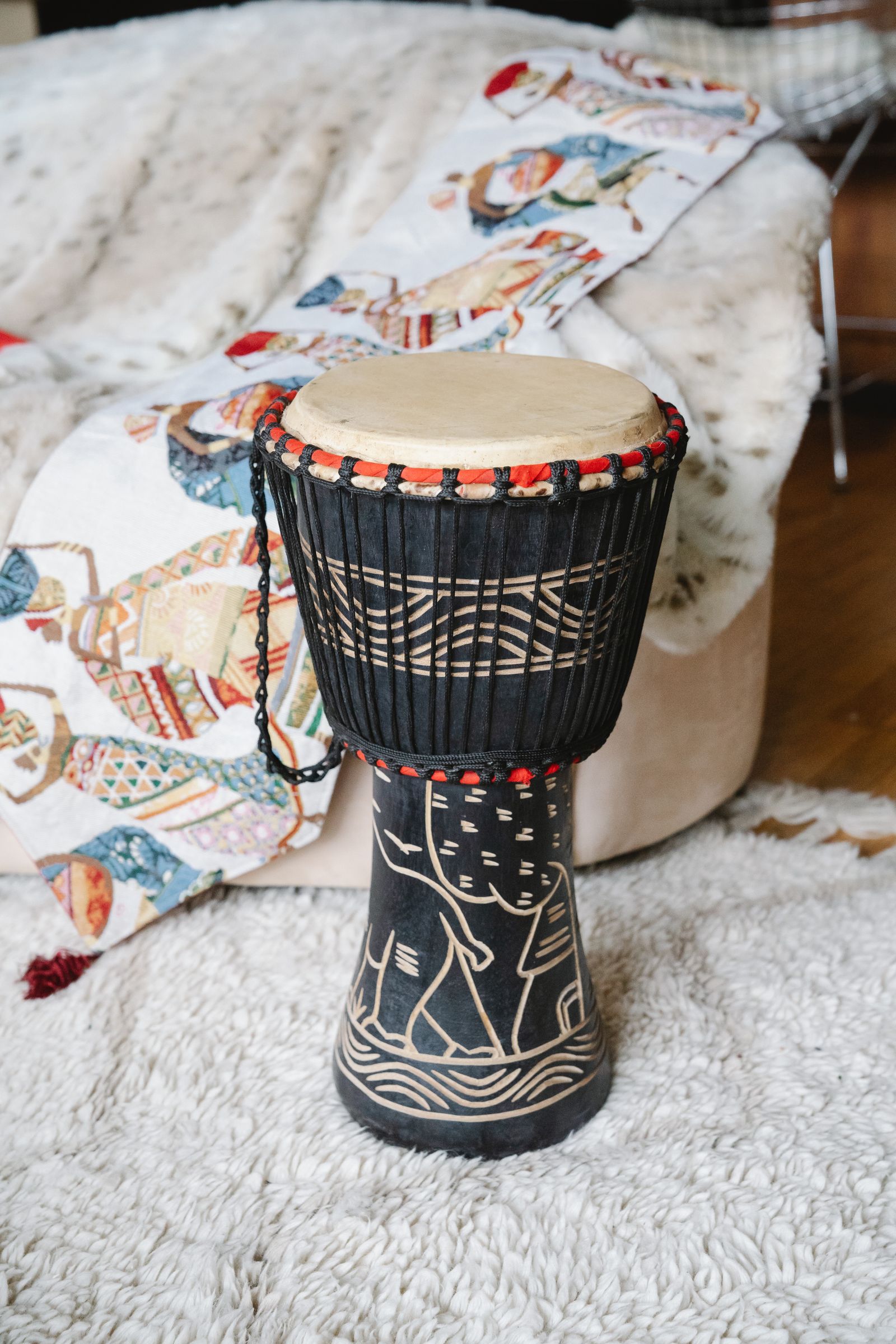 Carved djembe drum