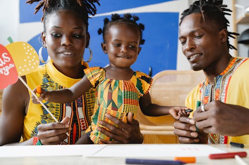 A Happy Family Wearing Traditional Clothes