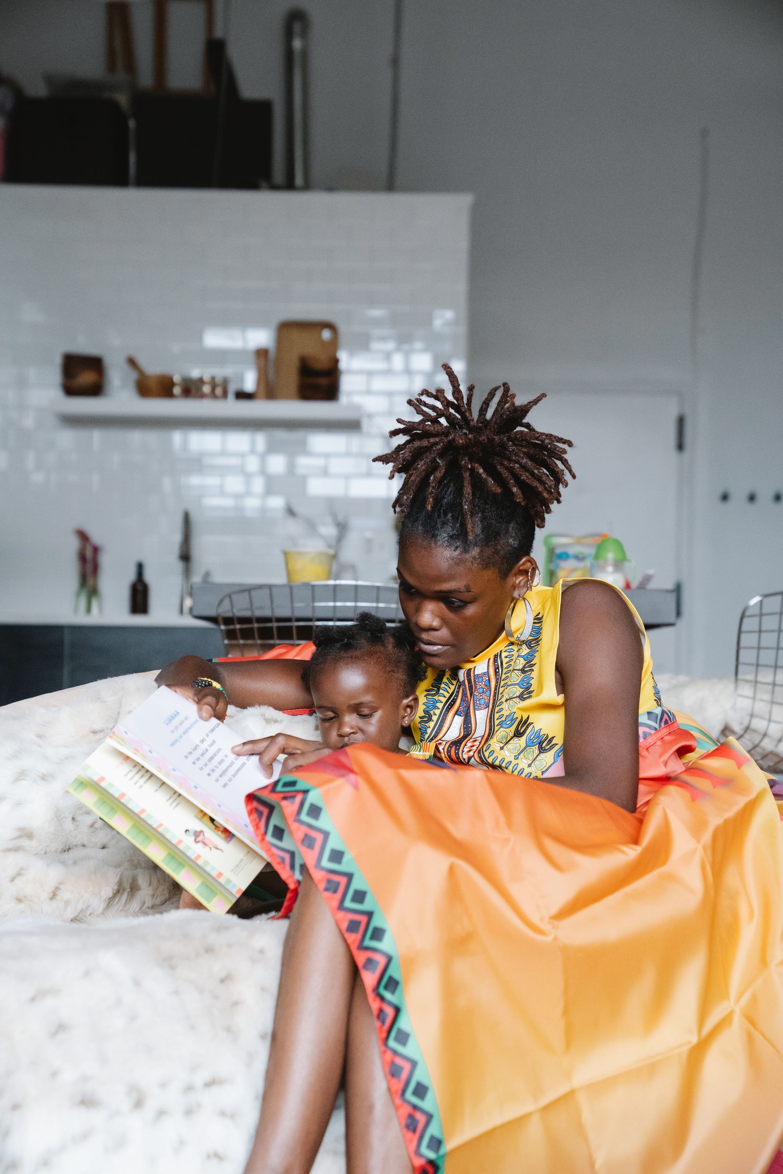 A parent and child reading together