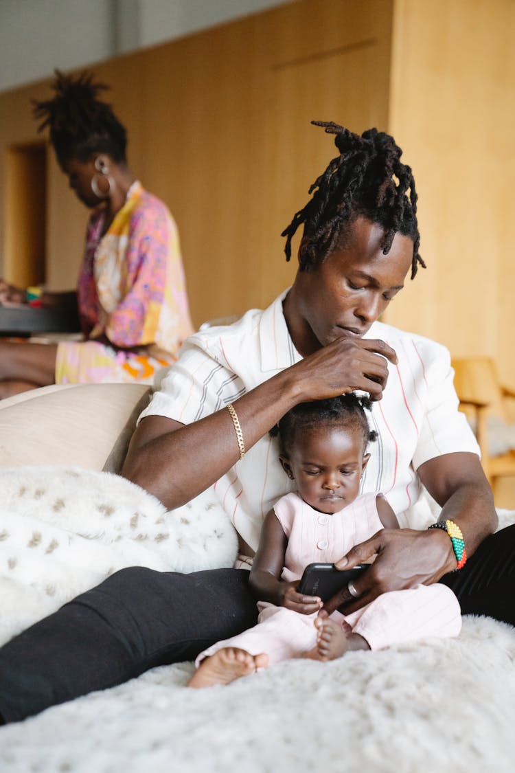 A Dad Fixing His Daughter's Hair