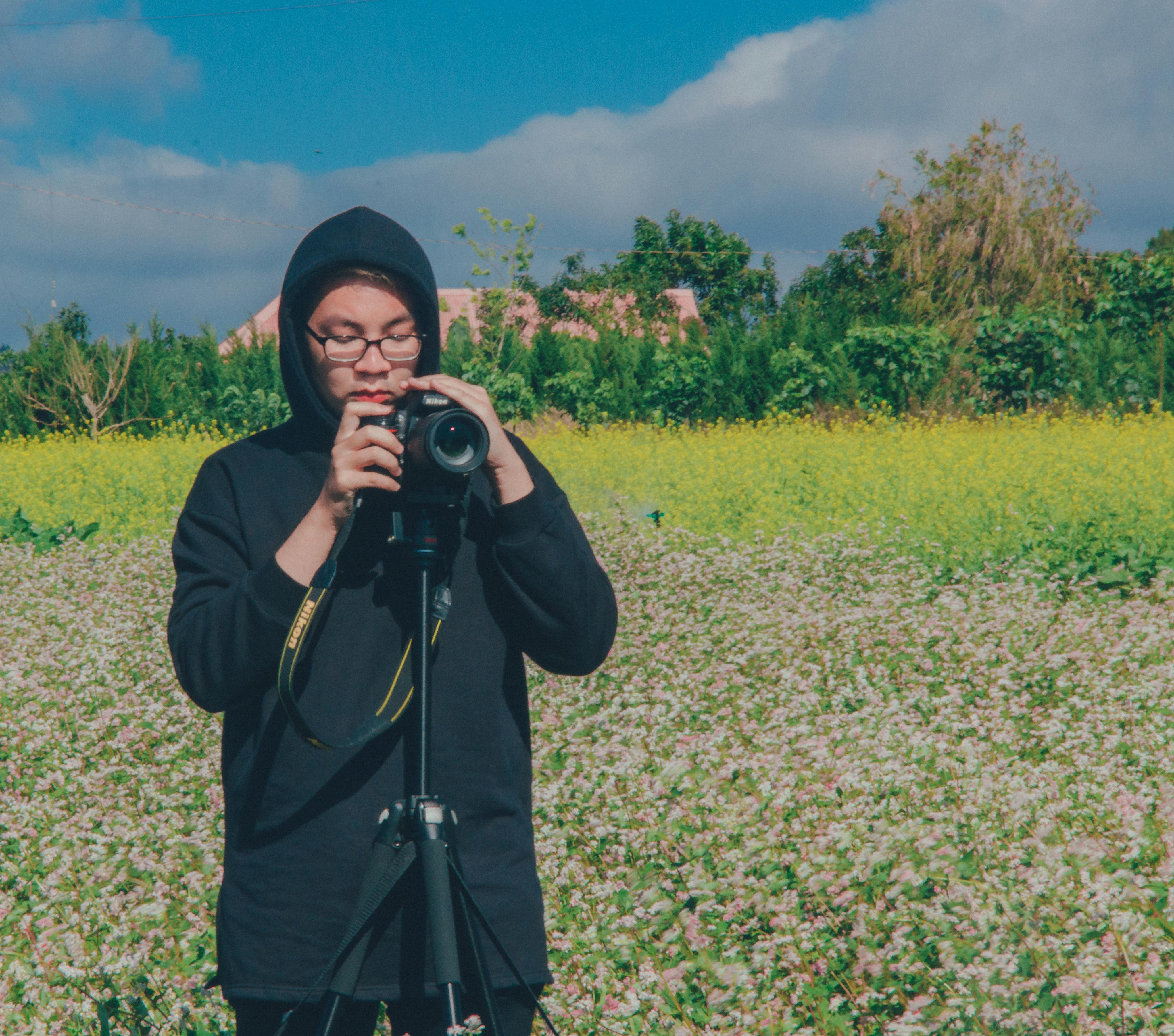 person holding dslr camera